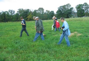 Dr. Susan Beal (closest to camera) was the tour guide for this 5-day tour of 11 holistically managed, organic dairies in the Northeast.