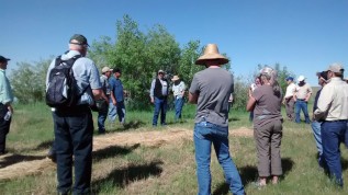 Byron Shelton (in center facing camera) and Dan Nosal (to left) led a pasture walk at the Flying B Bar Ranch as part of the AGA 2015 Conference.