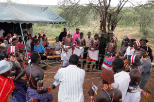 Samburu morans (warriors) demonstrating to the workshop group the interconnections of biodiverstity (community dynamics).