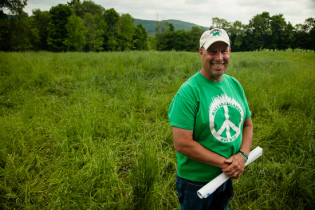 Troy Bishopp stands on a rotationally-grazed farm operated by Karl Palmer in Madison County, Md., on May 28, 2015. "We’ve helped with the water system here—fencing, some buffers and just overall pasture management," Bishopp said.